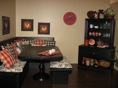 a black table with red and white pillows on it