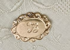 Antique Victorian rose goldfilled scallop edges in oval brooch. Circa 1900's Total width is 1.20 inch and .90 inch length looks like waves engraving on the sides and a letter K monogram in the front. A great antique brooch piece with S & G hallmark on the back. Letter K Monogram, K Monogram, Antique Brooches, Letter K, A Letter, Scalloped Edge, Antique Victorian, Hallmark, Brooch Pin