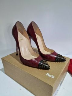 A fabulous pair of Christian Louboutin Cabo Pump 120 Kid/Water Snake Candel/Ring high heel pumps.  The shoes have black and gold studs to the toe in calf skin with burgundy shoe in water snake and black/white/grey water snake heel.  The shoes are in extremely good condition with no scuffs to the shoes or heels.   These were purchased from Net A Porter for the sum of £865.  The shoes come with the original box, dust bags, tissue paper lining and two small Louboutin heel bags containing 2 sets of Burgundy Shoe, Water Snake, Snake Heels, Burgundy Shoes, Louboutin Heels, Gold Stud, Heel Pumps, High Heel Pumps, Gold Studs