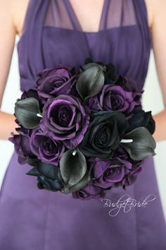 a woman in a purple dress holding a bridal bouquet with black and grey flowers