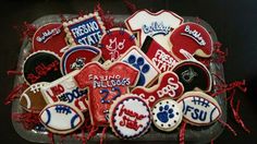 some decorated cookies are in a plastic container