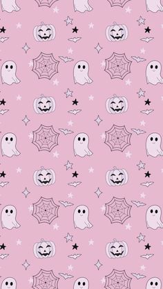 a pink background with black and white ghost faces, stars and webs on it