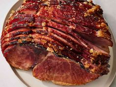 a large piece of meat sitting on top of a white plate