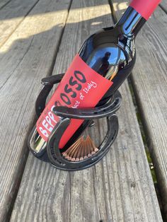 a wine bottle holder sitting on top of a wooden bench