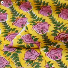 yellow and pink flower print fabric with green leaves