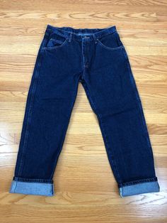 "Classic and cool vintage high waisted, regular fit dark wash Wrangler jeans from the 90s. Feature a 1.25\" fitted waistband with 7 belt loops, a branded metal button and 6\" zipper fly front closure. Classic 5 pocket style with slightly tapered straight legs and a regular fit. Made of a dark wash denim material. The perfect pair of classic denim. Freshly laundered and ready to wear. Label: \"Wrangler\". Made in Mexico. Fiber content: 100% cotton. Stamped size: 34 x 29. Please see measurements t Vintage Wrangler Jeans, Vintage Wrangler, Denim Material, Simple Chic, Vintage Blazer, Classic Chic, Wrangler Jeans, Embroidered Jacket, Fall Collection