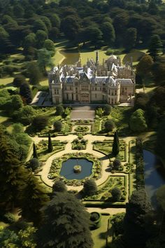 an aerial view of a large building surrounded by lots of trees and bushes, with a pond in the foreground