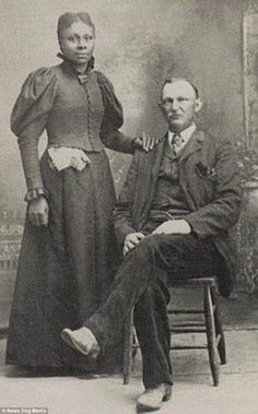 an old black and white photo of two people