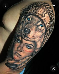 a woman with a wolf tattoo on her arm