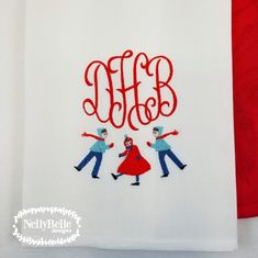 two people are dancing together on a white towel with the word monogrammed in red