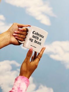 two hands holding up a coffee mug that says, anyone will be a big deal