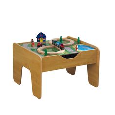 a wooden table with a toy train set on the top and two children's toys in the bottom