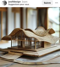 a wooden model of a house on top of some wood planks with text reading, iwolddesign 25m suggestions pour vous