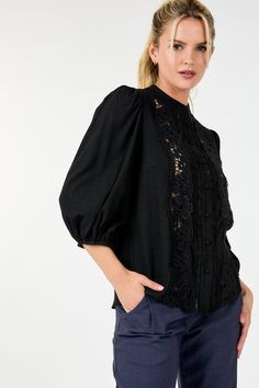 Indulge in the feminine elegance of our Women's 3/4 Lace Crochet Button Down Blouse. Crafted with delicate lace crochet, this top exudes sophistication and grace. The button-down design adds a touch of classic charm. Elevate your wardrobe with this exclusive and timeless piece. This top boasts delicate lace detailing that exudes femininity and refinement while its 3/4 sleeves strike a balance between coverage and freedom of movement. The collarless design lends a modern touch.Additionally the long popcorn sleeves add texture and visual interest elevating the tops overall appeal. - Solid - Round neckline I Collarless - Lace detailing - 3/4 Sleeve I Popcorn Elegant Fall Lace Crochet Top, Elegant Lace Crochet Top For Fall, Elegant Long Sleeve Blouse With Crochet Trim, Elegant 3/4 Sleeve Top With Button Closure, Elegant Lace Top With Crochet Trim, Elegant Top With 3/4 Sleeves And Button Closure, Lace Blouse With Button Closure For Work, Fall Lace Top With Button Closure, Elegant Fitted Lace Top With Crochet Trim