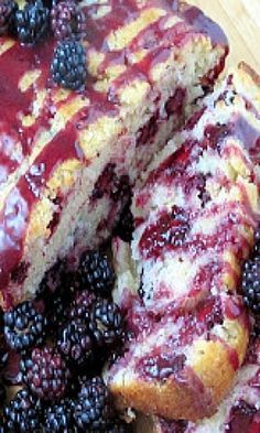 a close up of a cake with berries on it