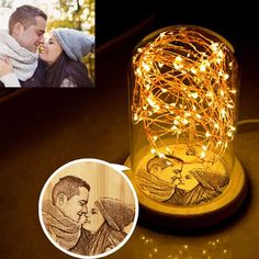 a couple kissing under a string light in a glass jar with an engraved photo on it