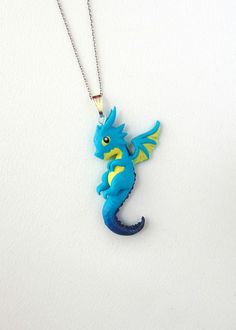 "Polymer Clay Baby Dragon Necklace - Small Dragon Pendant - Chibi Dragon Necklace - Dragon Jewelry - Dragon Friendship Necklace - Polymer Clay Jewelry Super cute hand sculpted Baby Dragon Pendants. Comes with a silver stainless steel necklace or Satin Cord. Real sterling silver necklace possible on request. Buy two and have a great Friendship Necklace Set! Dragon Fans will love this piece of art! Entirely handmade with Polymer Clay by me. *CUSTOM ORDER! The actual product could look slightly dif Cute Blue Necklace For Birthday, Playful Blue Jewelry For Jewelry Making, Handmade Polymer Clay Playful Necklaces, Handmade Playful Polymer Clay Necklaces, Handmade Cute Polymer Clay Necklaces, Cute Handmade Polymer Clay Necklaces, Playful Handmade Turquoise Jewelry, Cute Blue Polymer Clay Jewelry, Handmade Blue Necklaces For Birthday