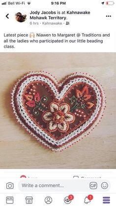 an image of a heart with flowers on it