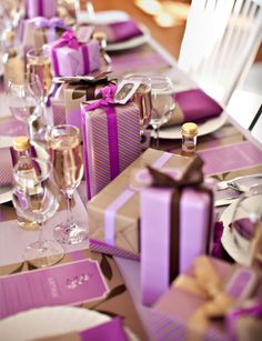 the table is set with purple and white napkins