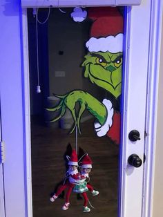 two elfs are hanging from the front door