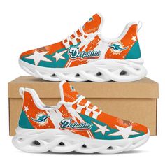 miami dolphins sneakers in orange and teal on top of a cardboard box with the team's logo