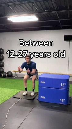 a man is squatting on a mat in an indoor gym with the words between 12 - 27 years old