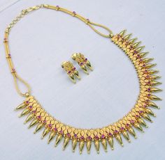 "Vintage 22 karat solid gold spiky design necklace(champakalee har) with earring pair from rajasthan india. made of solid 22 karat gold and sated ruby color stones. full handcrafted great piece for your jewelry collection. buyer will get gold test report for this item for free. total weight of set-66 grams(2.31 ounce), total lenght of necklace-18\"(we can adjust length),width of necklace-1\",material -solid 22 karat gold." Spiky Choker, Gold Ruby Necklace, Ruby Color, Color Stones, Gold Bead Bracelets, Choker Set, Ruby Necklace, Rajasthan India, 925 Silver Earrings