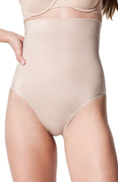 This lightweight thong compresses and smoothes with 24/7 comfort and no panty lines. Cotton-lined gusset 51% elastane, 49% nylon Dry clean or machine wash, dry flat Imported Elegant Full Coverage Stretch Shapewear, High Stretch Smoothing Beige Bottoms, Full Coverage Stretch Shapewear Bottoms, Stretch Full Coverage Shapewear Bottoms, Elegant Stretch Shapewear With Soft Touch, Supportive Fitted Seamless Bottoms, Supportive Seamless Fitted Bottoms, Beige High-cut Leg Stretch Shapewear, Beige Stretch High-cut Leg Shapewear