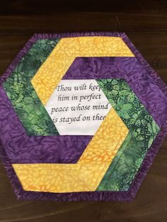 a purple and yellow hexagon with a quote on it that says thou will keep firm in perfect peace whose mind is staying on them