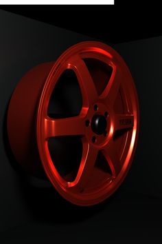 a red wheel on a black background