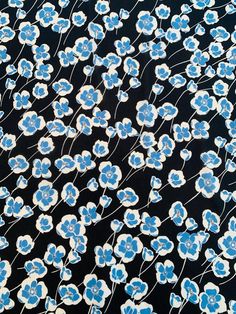 blue flowers on black background with white and blue lines in the bottom right hand corner