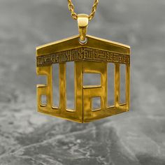 Crafted with precision and meaning, this Kaaba Necklace is a striking piece of Islamic jewelry that delicately encapsulates devotion. Made from 925 sterling silver and elegantly plated with 18K gold, it exudes a luxurious appeal. The pendant features the intricate Kufic calligraphy of Tawheed, symbolizing the oneness of God, making it a profound and thoughtful gift for Muslim women. Its design captures the essence of spirituality and tradition, adding a touch of elegance to any outfit. This neck 22k Gold Polished Jewelry Gift, 22k Gold Jewelry With Polished Finish For Gift, 22k Gold Jewelry With Polished Finish As Gift, Symbolic Gold Jewelry For Blessing, Ceremonial Gold Rectangular Jewelry, Rectangular Gold Jewelry For Ceremonial Occasions, Rectangular Gold Ceremonial Jewelry, Gold Polished Nameplate Jewelry, Gold Engraved Jewelry For Blessing