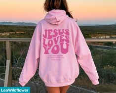 Looking for a christian hoodie ? Our Jesus loves you hoodie is the perfect gift for all! It's made of a soft comfortable blend of high-quality materials and is sure to last for years to come. It's perfect for wearing on a cold day, out for a hike, or just lounging around the house. ★Shipping This is a made to order item Our turn around time is 1 to 3 business days. If you need any item by a certain date, please message us and we'll see what we can do! ★Size This sweatshirt is unisex sizing. (Siz Bible Verse Aesthetic, Verse Aesthetic, Christian Sweatshirts, Aesthetic Christian, Jesus Sweatshirts, Christian Hoodies, Hoodie Aesthetic, Christian Sweatshirt, Faith Over Fear