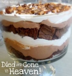 a layered dessert in a glass dish with the words, died and gone to heaven