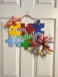 a colorful puzzle door hanger that says, mrs huddleton