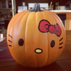 a hello kitty pumpkin sitting on top of a table