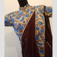 Elegant Brown Saree With Blue Floral Border Comes With Blouse Size Small Brand New Brown Georgette Perfect For Parties And Special Occasions Festive Blue Floral Print Blouse, Blue Georgette Blouse With Zari Work, Designer Blue Top With Traditional Drape, Blue Floral Print Georgette Blouse Piece, Fitted Blue Georgette Blouse, Blue Floral Print Blouse Piece In Georgette, Designer Floral Print Fitted Blouse, Fitted Floral Print Blouse For Designer Wear, Festive Blue Georgette Tops