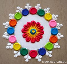 the colorful flower is made out of felt and has many different colored circles on it