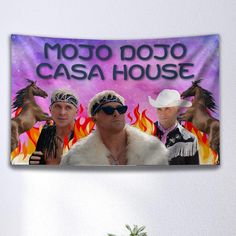 two men with bandanas on their heads are standing in front of a sign that says moto dojo casa house