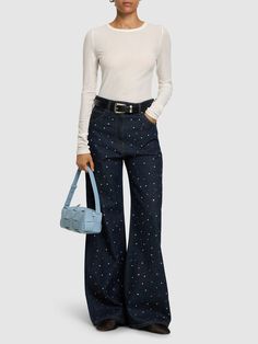 Front button and concealed zip closure. Belt loops. Embellished with crystals. All over pattern placement may vary. Five pockets. Model is wearing a size38 Versace Brand, All Over Pattern, Embellished Denim, Wide Jeans, Flat Espadrilles, Jeans Jumpsuit, Swim Accessories, Shearling Jacket, Heeled Loafers