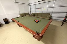 a pool table in the middle of a room