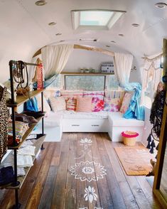 the inside of a camper with lots of furniture