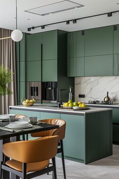 a modern kitchen with green cabinets and marble counter tops, along with an island in the middle