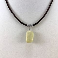 New, Unisex Green Jasper Stone Pendant Necklace Leather. Festival Ready! Surfer Dude, Rugged Outdoorsman, Boho, Gorpcore Necklace. Great Gift For Dad, A Brother, Or A Boyfriend. Stone; Semi Precious Jasper In A Light, Yellowish Green Color. Brand; Handmade By Seller, Jennifer Lerner Design. Cord; Genuine, Dark Brown, 3mm Thick Leather Cord. Length; 17" Plus A 2.5" Extender. Stone Size; Measures; 7/8" H X 1/2"W X 1/2" D. Metal; Tibetan Silver Bail, Silver Plated Clasp. Clasp; Nickel Free Silver P Adjustable Rectangular Necklace With Lobster Clasp, Rugged Outdoorsman, Surfer Dude, Yellowish Green, Necklace Leather, Great Gifts For Dad, Green Jasper, A Brother, Handcrafted Accessories