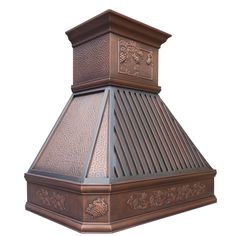 a copper colored stove top with intricate designs