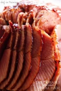 sliced ham sitting on top of a cutting board