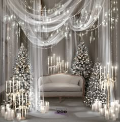 a living room decorated for christmas with white lights and silver trees on the wall next to a couch