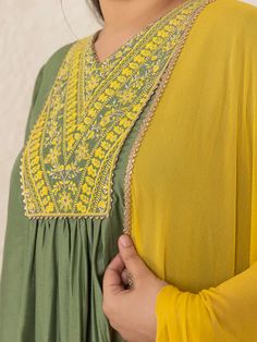 This is beautiful 3-piece set. The set comes with chinnon embroidered kurta has v neck, 3/4th sleeves and calf length teamed with solid flared palazzo pants and a chiffon dupatta with lace border. 3-piece set Color-Olive Green & Yellow Work - Yoke Embroidery Detailing Kurta Fabric-Chinnon Bottom Fabric - Chinnon Dupatta Fabric - Chiffon Kurta Length - 47 inch Sleeves- 3/4th Sleeveless Neck-V Neck Bottom Length - 37 inch Dupatta Length - 2.25 meter Care-Dry Clean or Hand wash