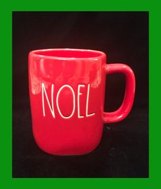 a red mug with the word noel written on it