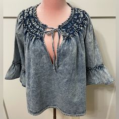 Pictured Is A New With Tag Bohemian Style Blouse By Free People In The Size Medium. Denim Is One Of The Most Versatile And Classic Items To Have In Your Wardrobeit Can Be Worn With Just About Anything! Additional Features Includes An Elastic Neck Design And Draw String Closure. *100% Cotton *Machine Washable And/Or Dry Clean ~The Measurements Are Pictured Above. Thank You For Shopping At Charms Kloset, I Truly Appreciate It. Please Let Me Know If You Have Any Additional Questions! Chambray Denim Top For Fall, Washed Blue Denim Top With Frayed Hem, Vintage Stonewashed Tops For Spring, Bohemian Medium Wash Denim Top For Fall, Bohemian Cotton Top With Ruffle Sleeves, Bohemian Cotton Tops With Ruffle Sleeves, Vintage Washed Blue Denim Top For Spring, Denim Blue Ruffled Short Sleeve Top, Casual Cotton Peasant Top With Ruffles